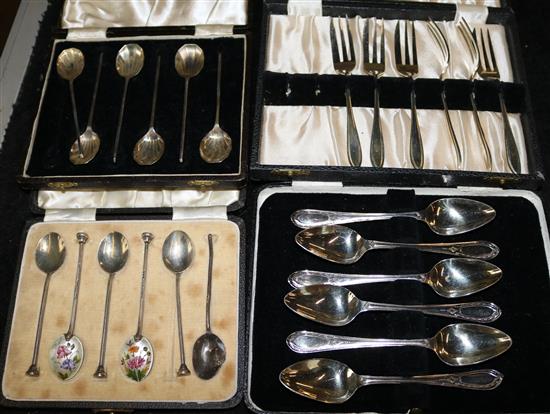 Two sets of six silver coffee spoons and three boxed sets of plated cutlery